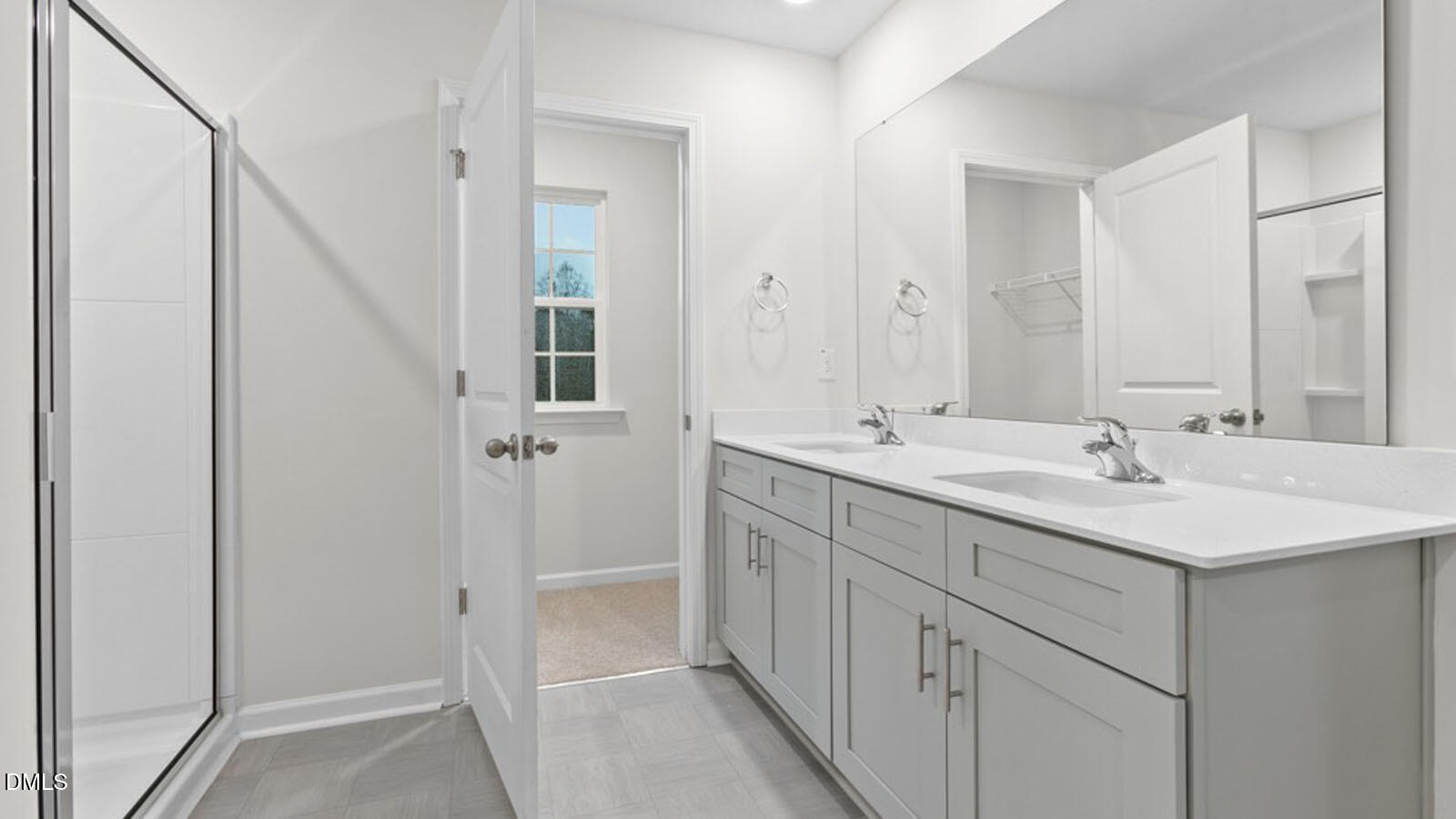 4027 Apollo Lane Snow Camp, NC 27349 - Photo 21 of 32 a bathroom with a double vanity sink and a mirror