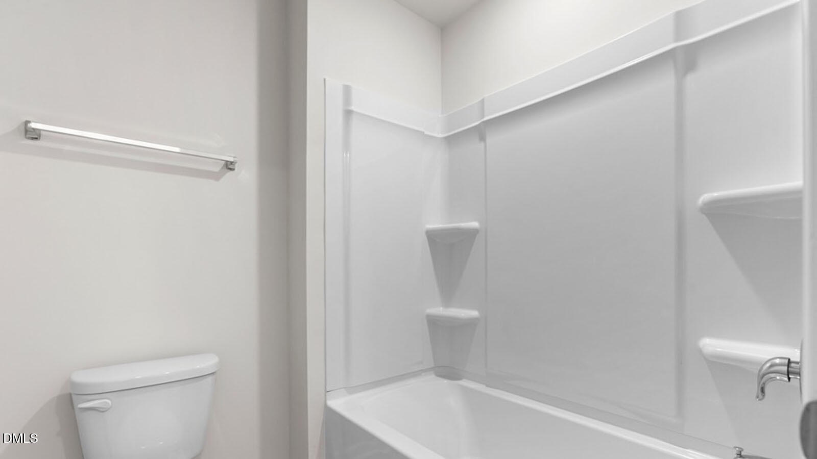 4027 Apollo Lane Snow Camp, NC 27349 - Photo 29 of 32 a bathroom with a toilet and a bathtub