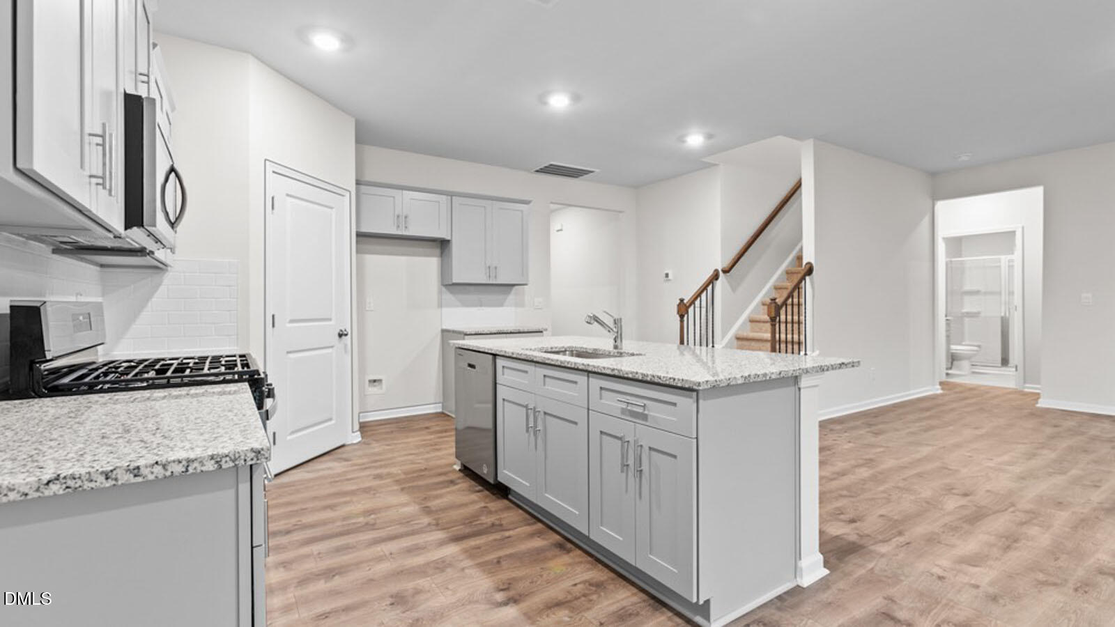 4027 Apollo Lane Snow Camp, NC 27349 - Photo 8 of 32 a kitchen with stainless steel appliances granite countertop a sink stove and refrigerator