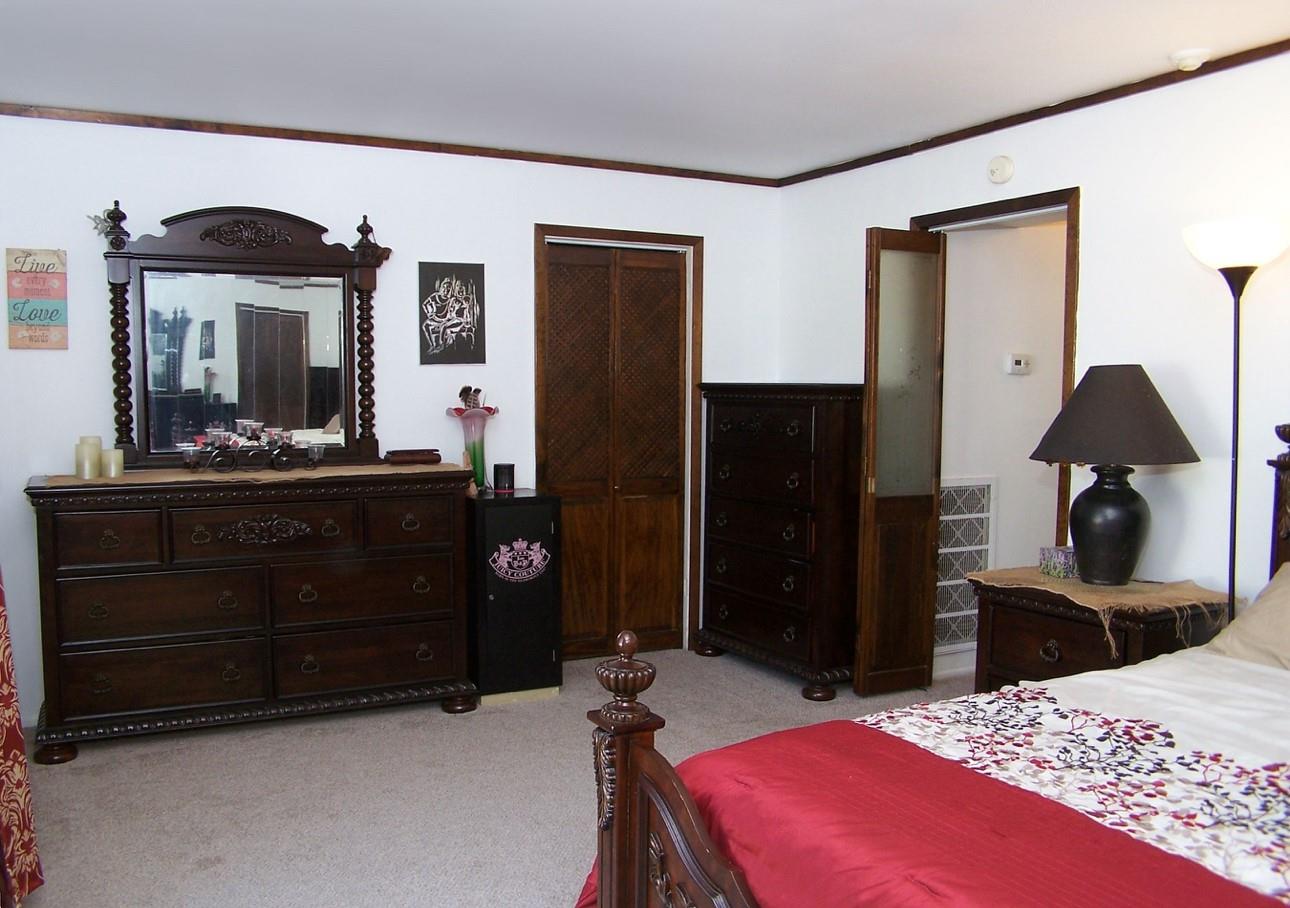 51 Rocky Point Yaphank Road, Unit 5 Rocky Point, NY 11778 - Photo 12 of 17 Bedroom with carpet, crown molding, and a closet