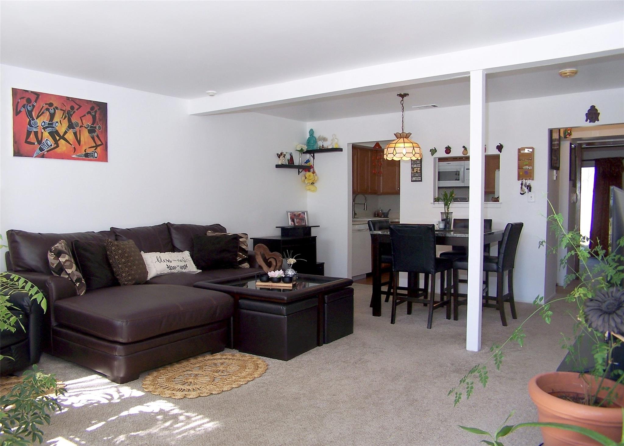 51 Rocky Point Yaphank Road, Unit 5 Rocky Point, NY 11778 - Photo 4 of 17 Living room featuring light carpet