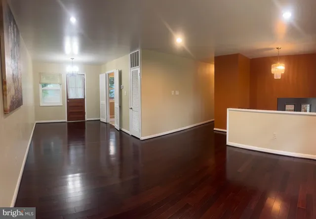 a view of a livingroom with wooden floor
