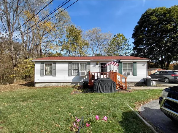 a front view of house with yard having seating