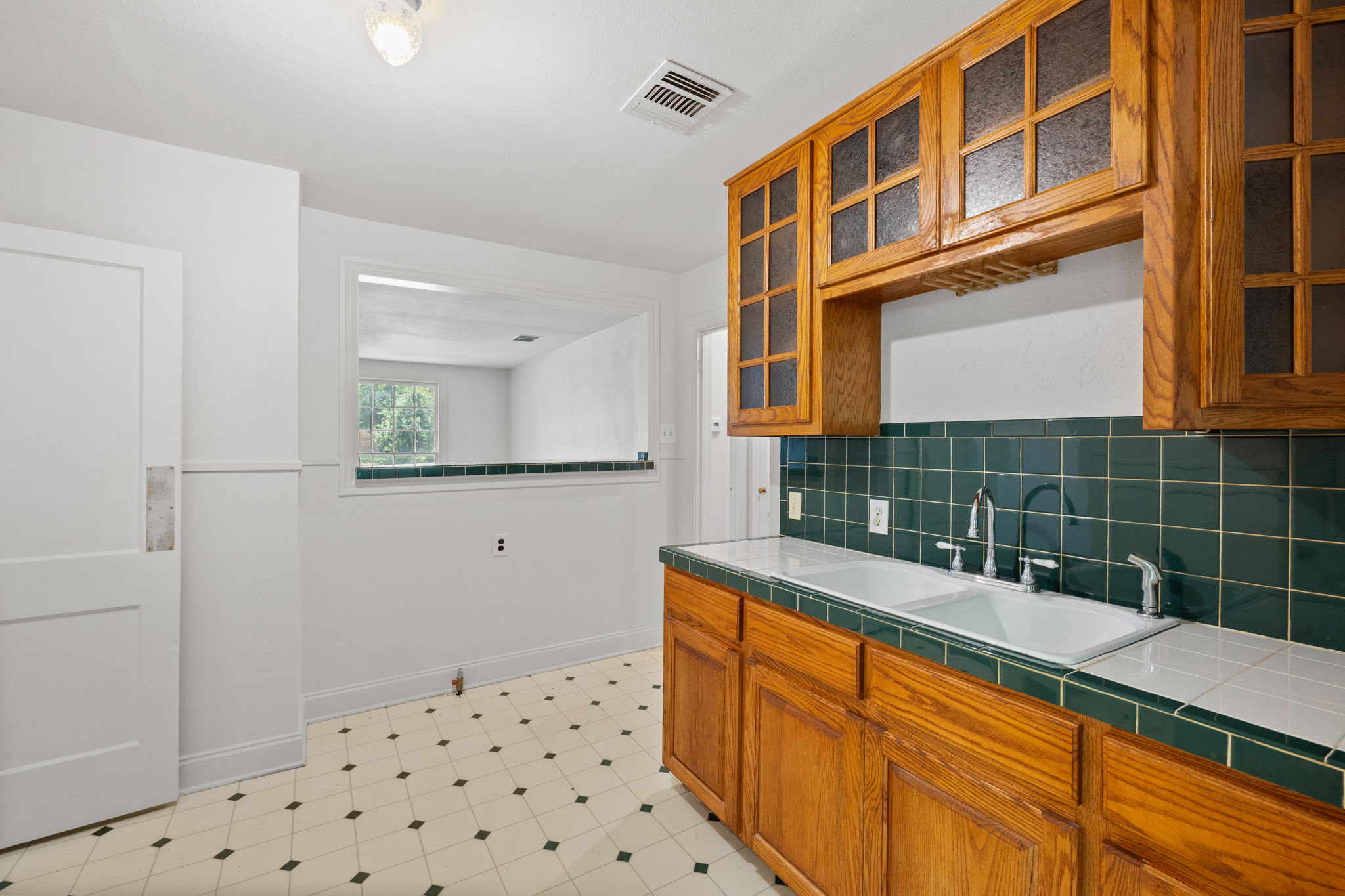 3704 Cherrywood Road Austin, TX 78722 - Photo 15 of 40 Kitchen opens to a pass through eating bar and living area.