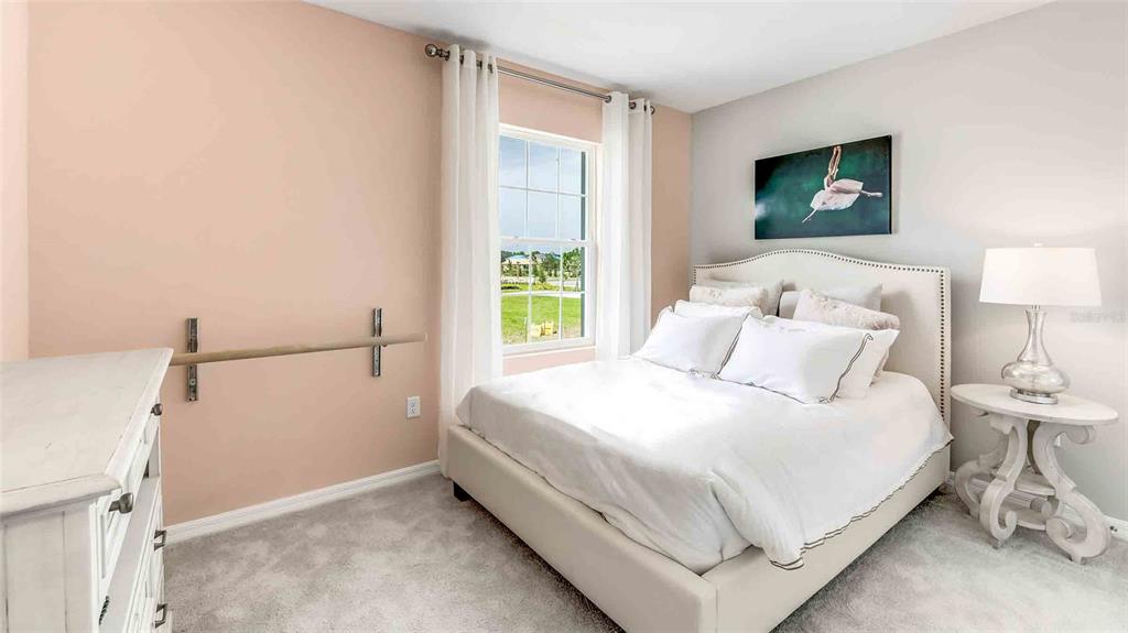 2337 Rikkola Lane Wesley Chapel, FL 33543 - Photo 12 of 17 a bedroom with a bed and a window