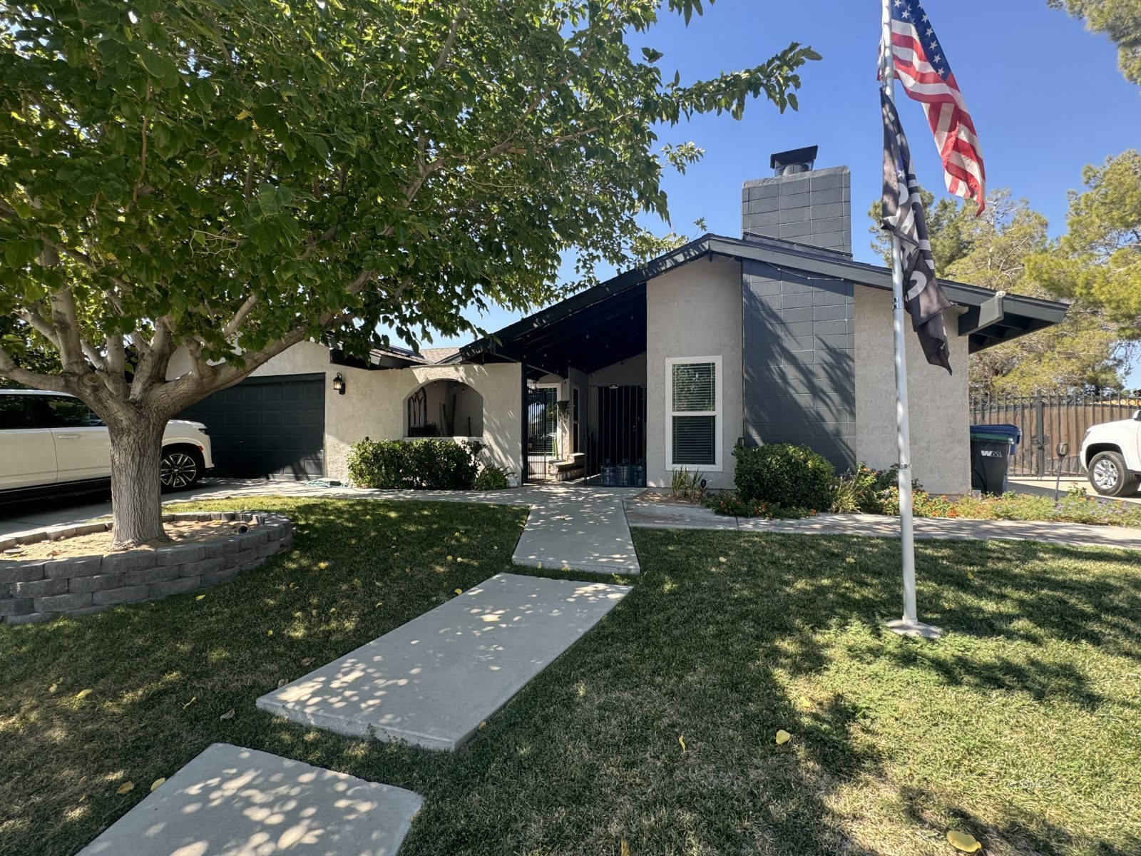 1024 Las Cruces Avenue Ridgecrest, CA 93555 - Photo 1 of 37 a front view of a house with garden