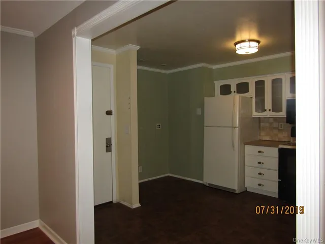 a view of hallway with wooden floor