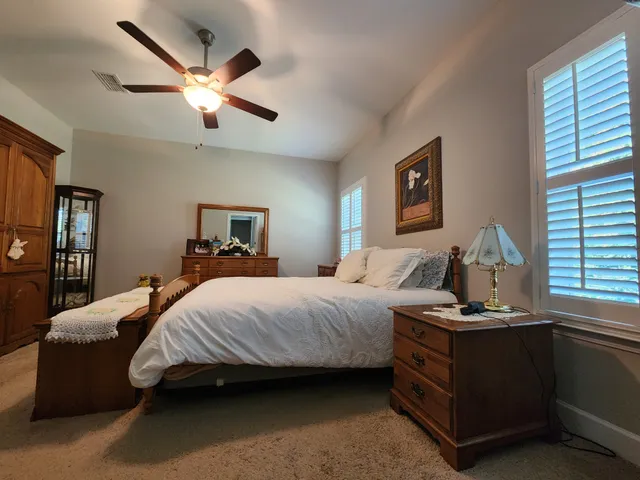 a bedroom with a bed and window