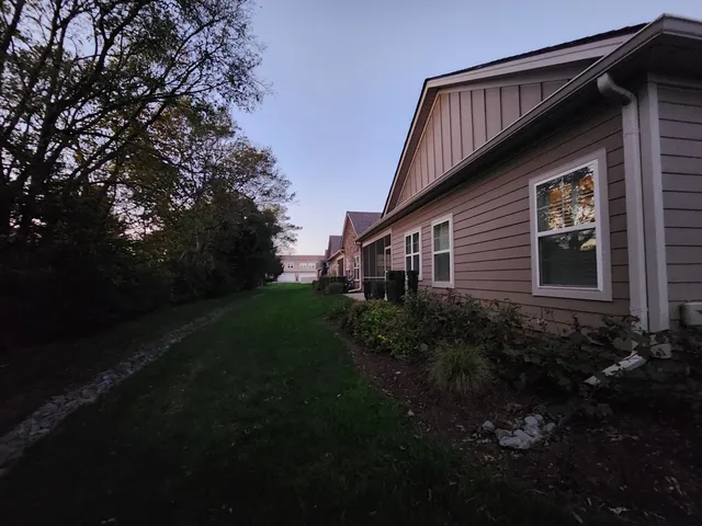 a backyard of a house with lots of green space