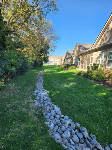 a view of a front of a house with a yard