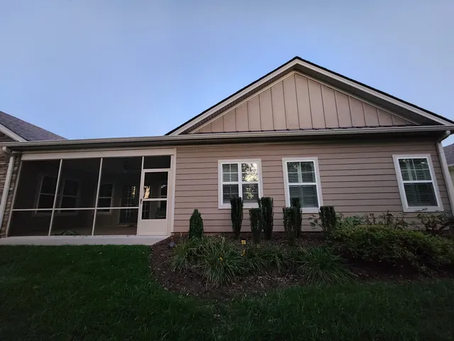 a view of front of house with a yard
