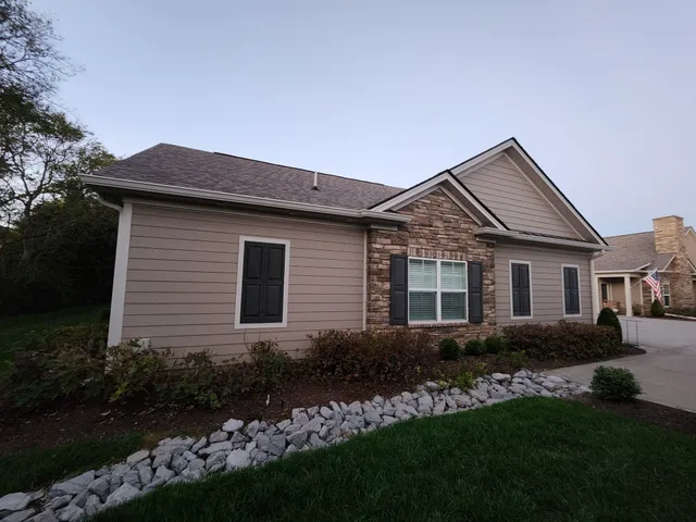 a view of a house with garden and yard