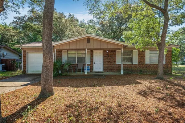 a front view of a house with a yard and porch