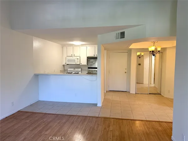 a view of a kitchen cabinets and wooden floor