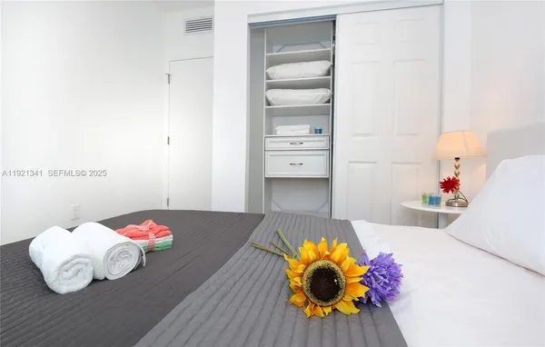 a bedroom with a bed and couch