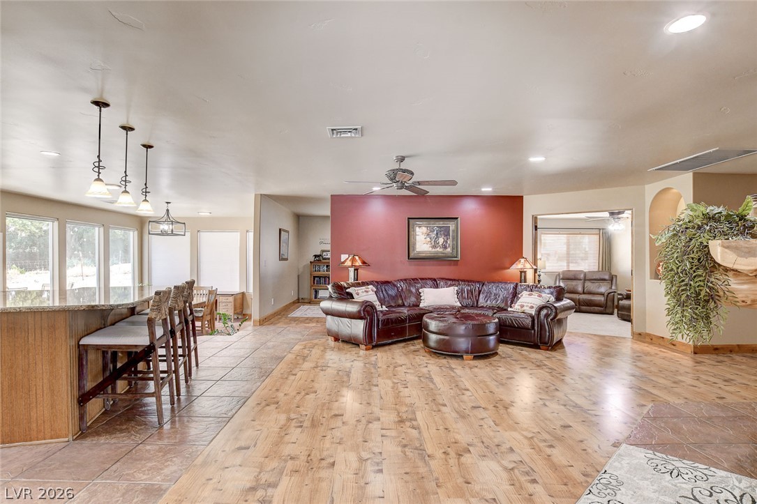 1950 Bowman Road Logandale, NV 89021 - Photo 79 of 81 An inviting open floorplan offers seamless transitions between living and dining areas, with laminate wood and tile floors throughout.