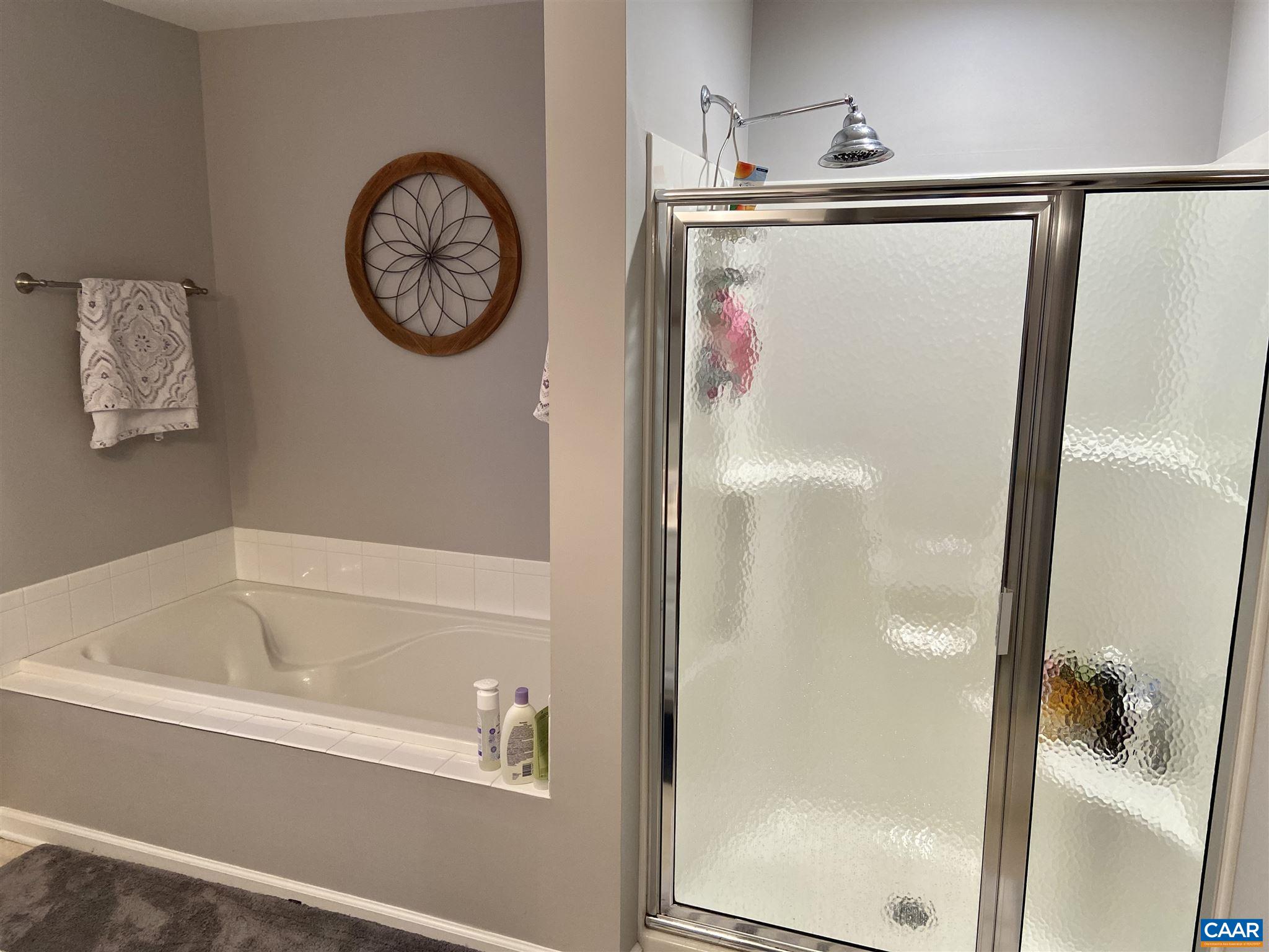 911 Raymond Road Charlottesville, VA 22902 - Photo 19 of 24 a bathroom with a bathtub and a shower