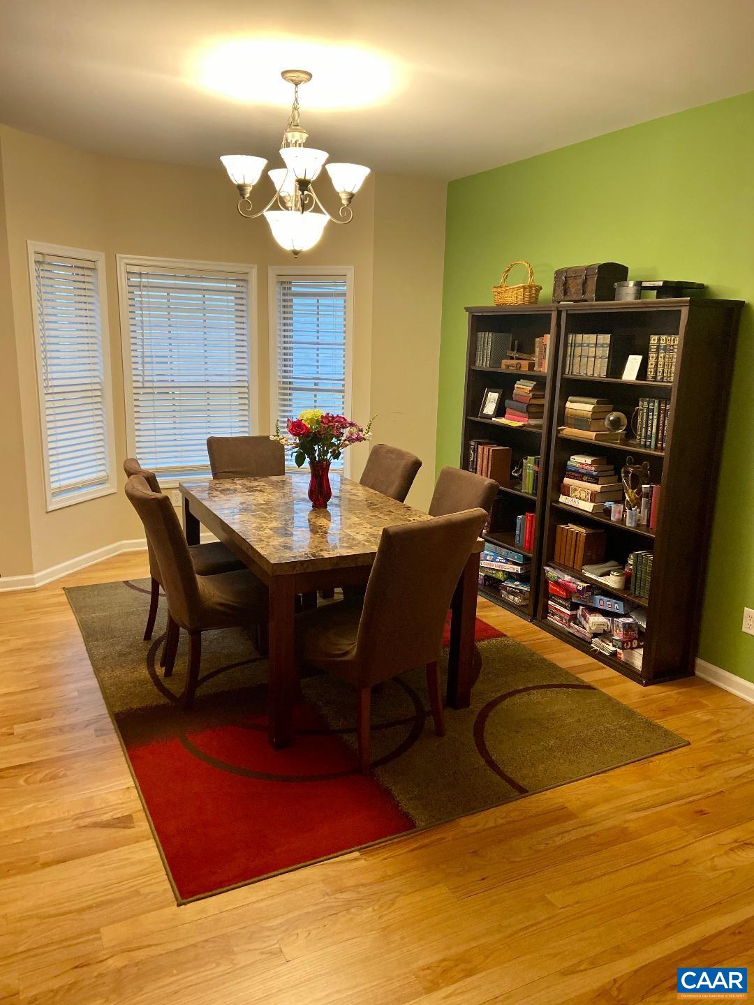911 Raymond Road Charlottesville, VA 22902 - Photo 9 of 24 a view of a dining room with furniture and chandelier