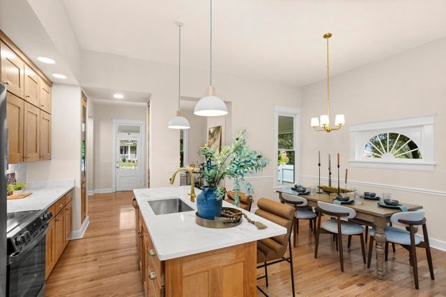 a view of a room with wooden floor and cabinet