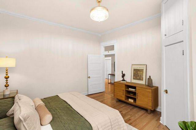 a bedroom with furniture and a window