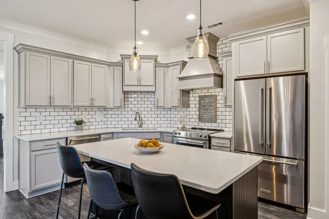 a bathroom with a sink a mirror and a shower