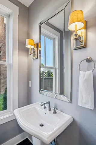 a view of a hallway with wooden floor and entryway