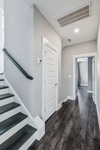 a view of a livingroom with furniture and a window