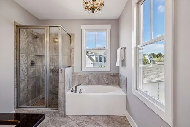 a view of hallway with wooden floor