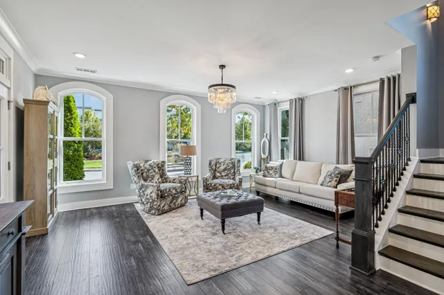 a living room with furniture and flat screen tv