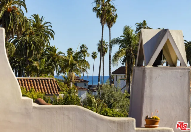 a living room with furniture a fireplace and a window
