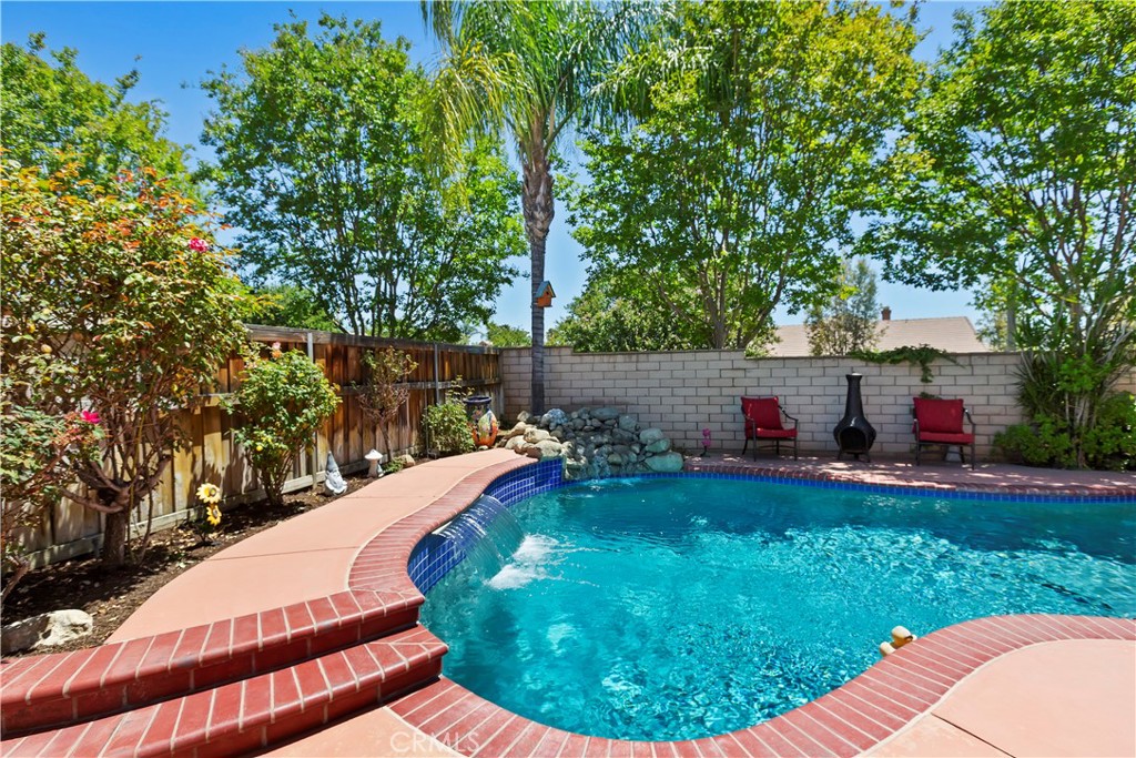 9609 Heartland Place Rancho Cucamonga, CA 91730 - Photo 3 of 48 Rock waterfall and pool waterfall feature.