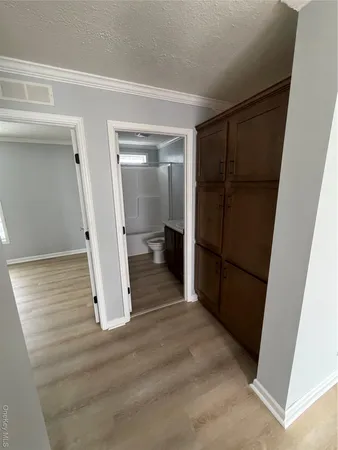 a view of a hardwood floor and a ceiling fan