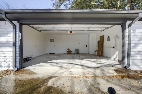 a view of garage with wooden floor