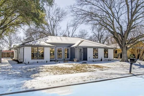 a house with trees in front of it