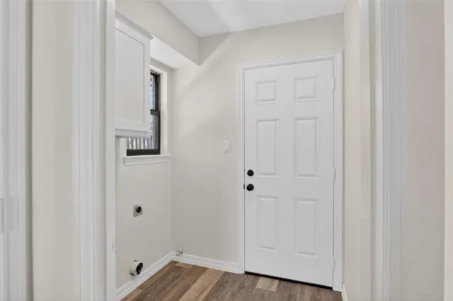a view of a bathroom with wooden floor