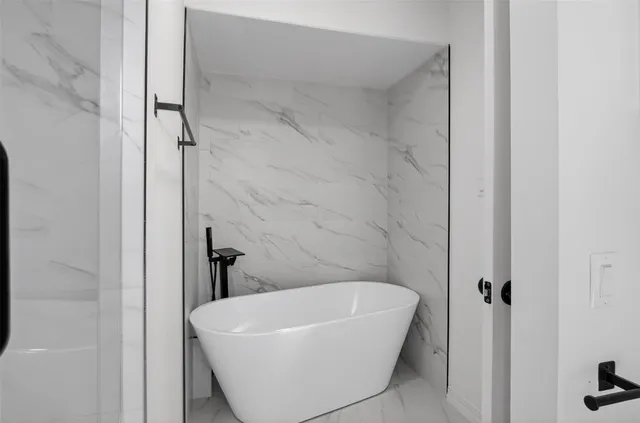 a bathroom with a white bath tub