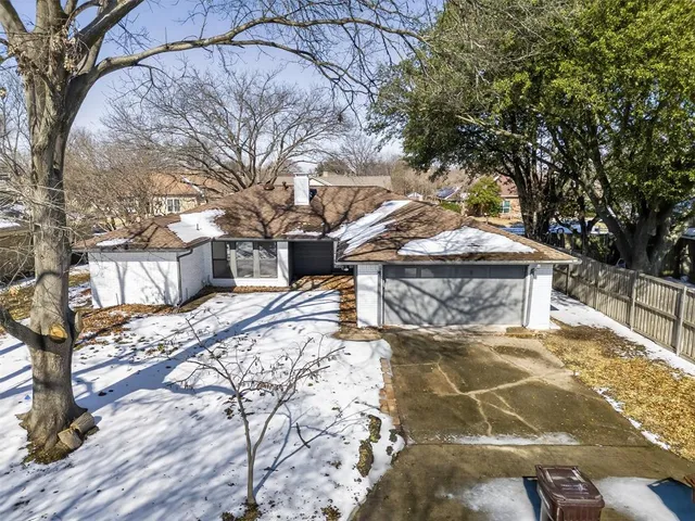 a view of a yard covered in snow