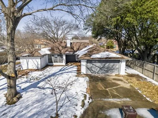 a view of a yard covered in snow