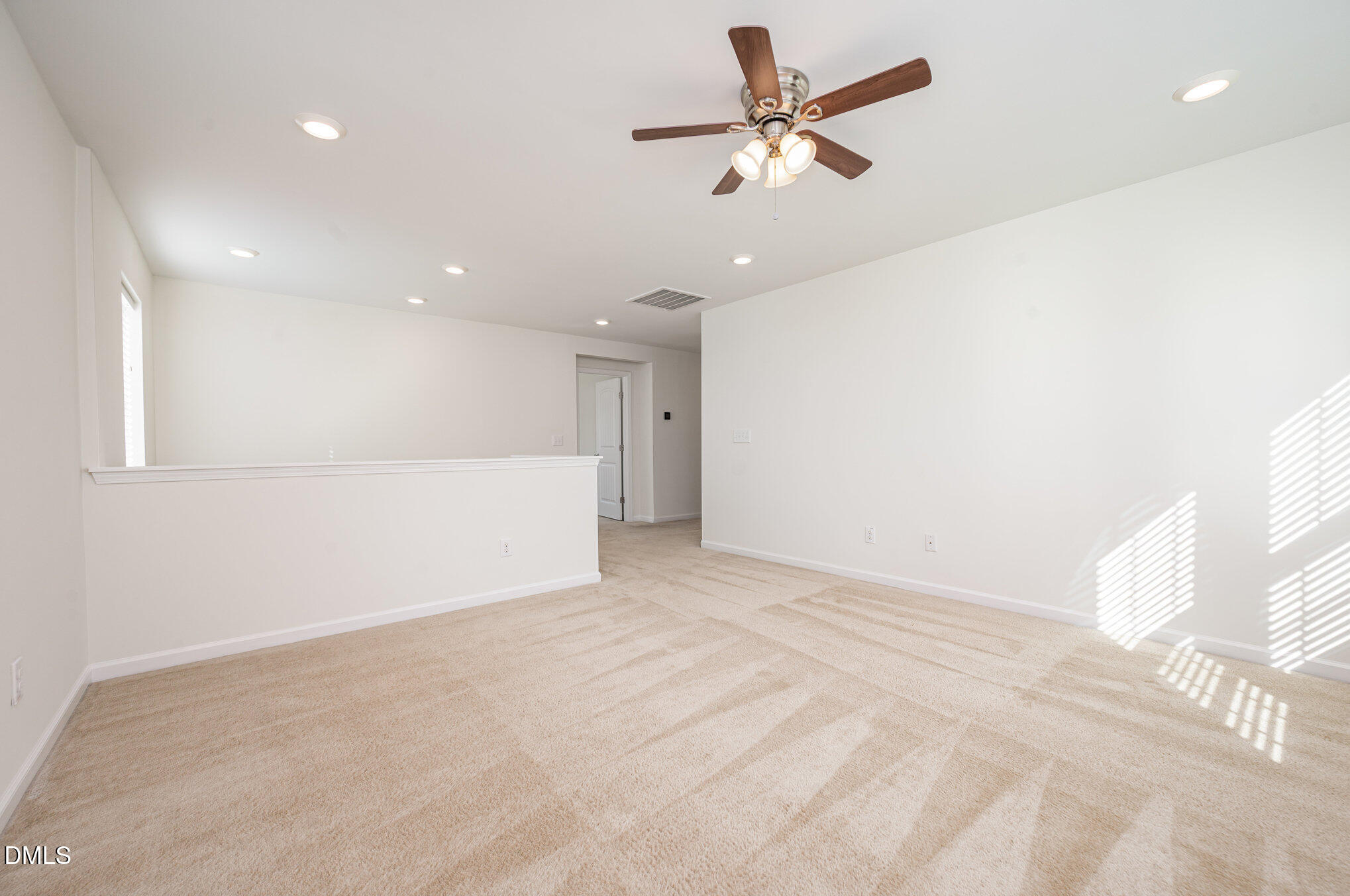 104 Oak Rise Lane Fuquay-Varina, NC 27526 - Photo 12 of 29 a view of an empty room with a chandelier fan