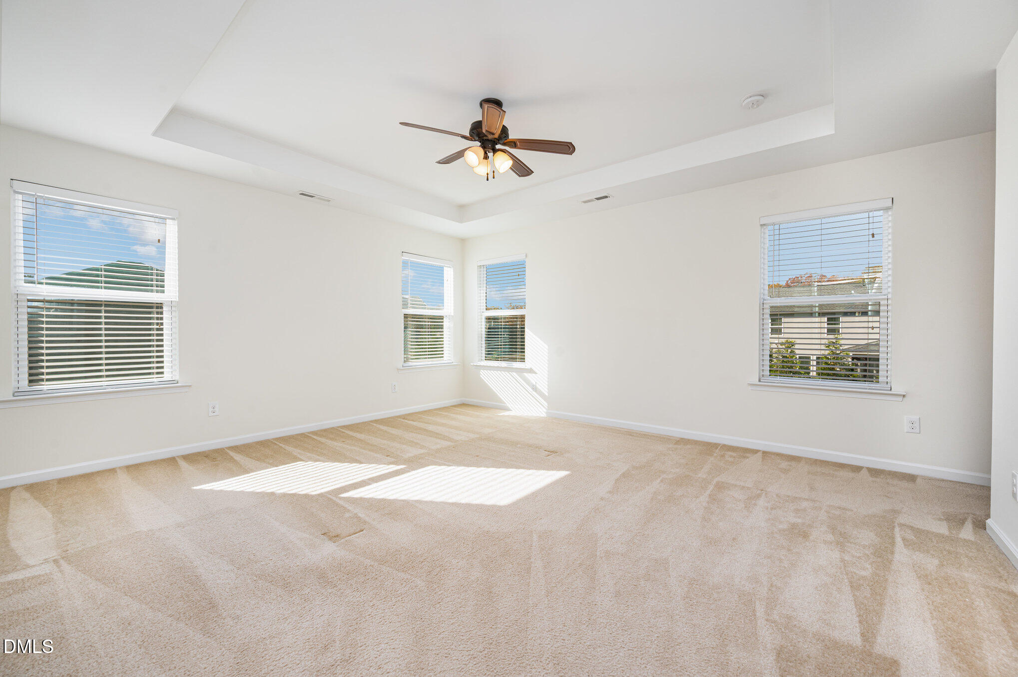 104 Oak Rise Lane Fuquay-Varina, NC 27526 - Photo 14 of 29 a view of a livingroom with a ceiling fan and window