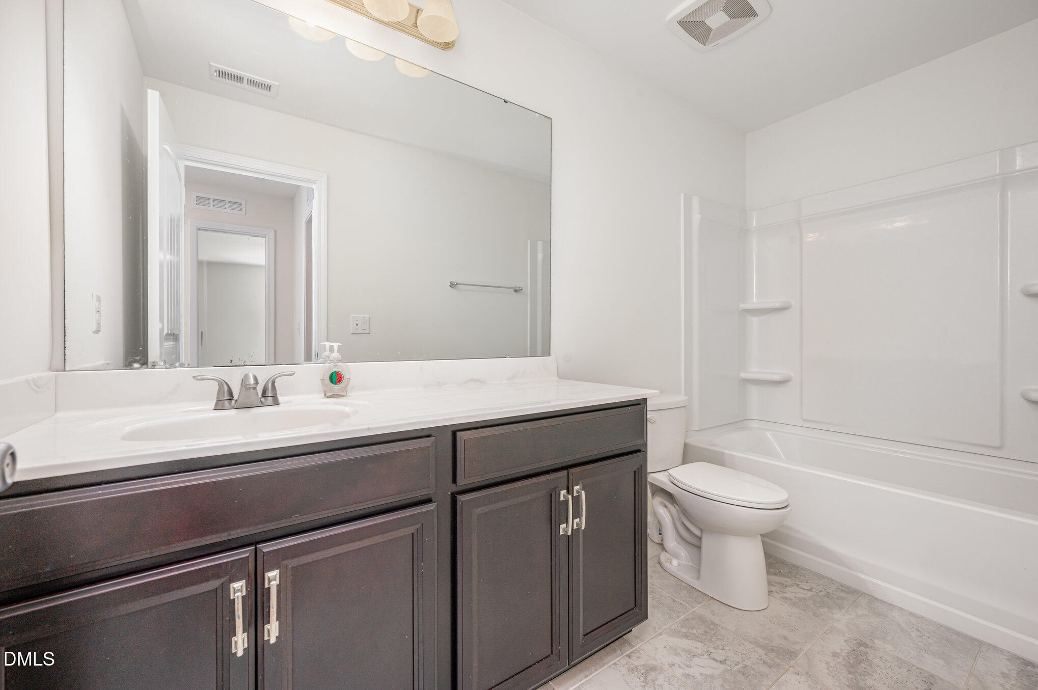 104 Oak Rise Lane Fuquay-Varina, NC 27526 - Photo 21 of 29 a bathroom with a sink a toilet and shower