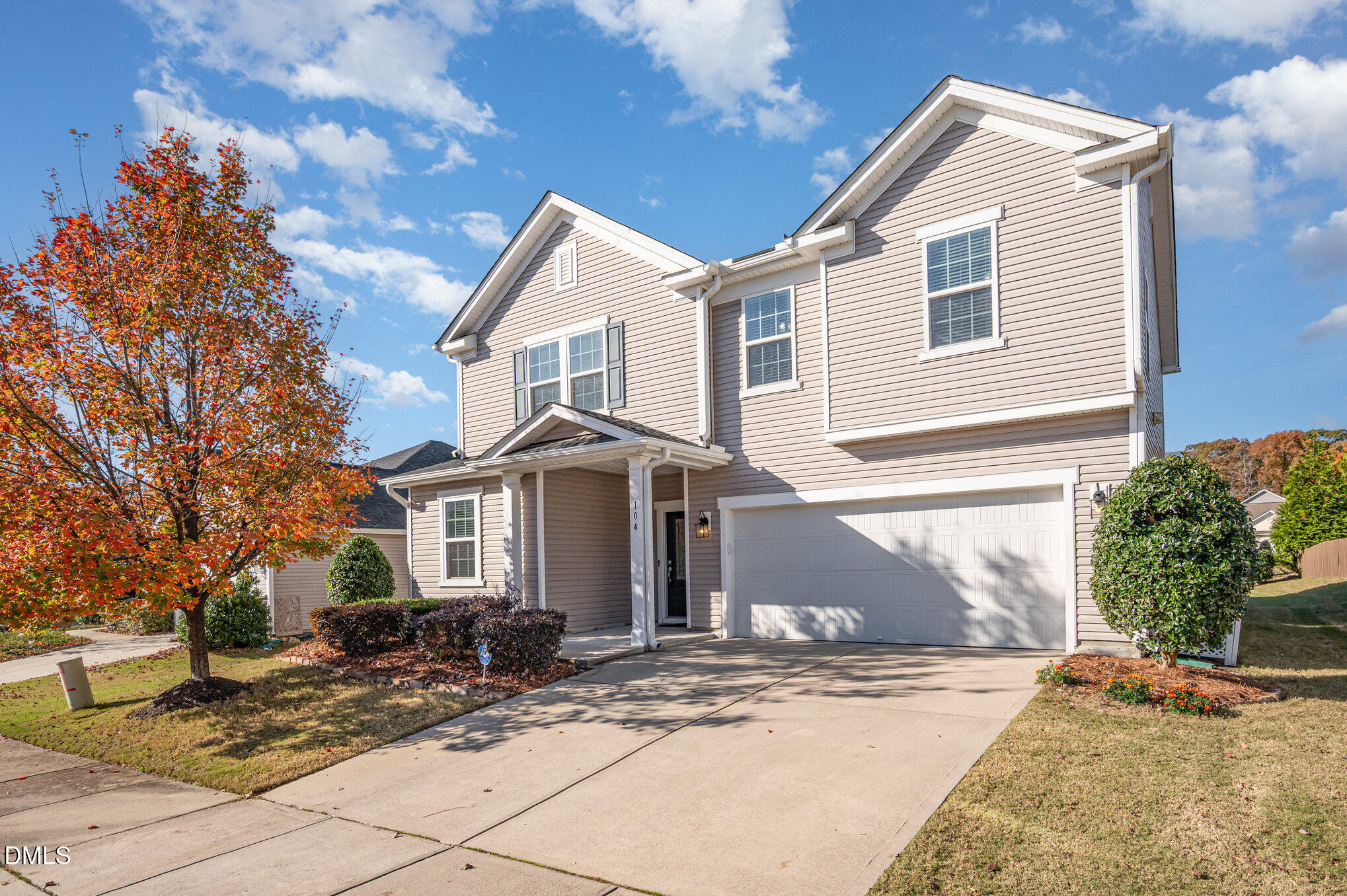 104 Oak Rise Lane Fuquay-Varina, NC 27526 - Photo 2 of 29 a front view of a house with a garden