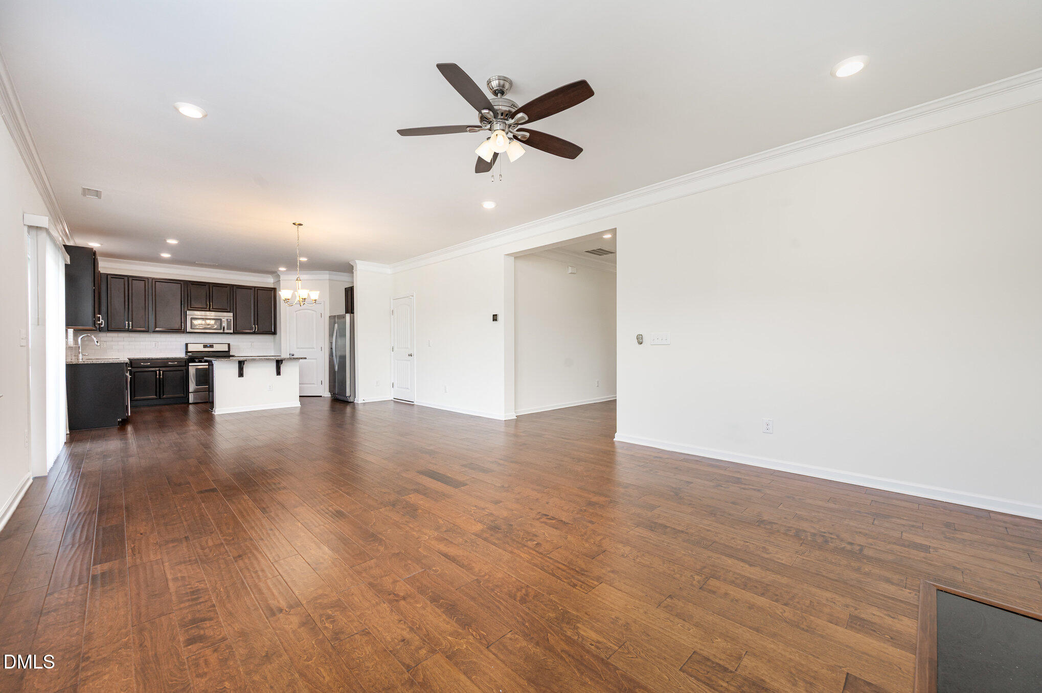 104 Oak Rise Lane Fuquay-Varina, NC 27526 - Photo 28 of 29 a view of a livingroom with kitchen and hardwood floor