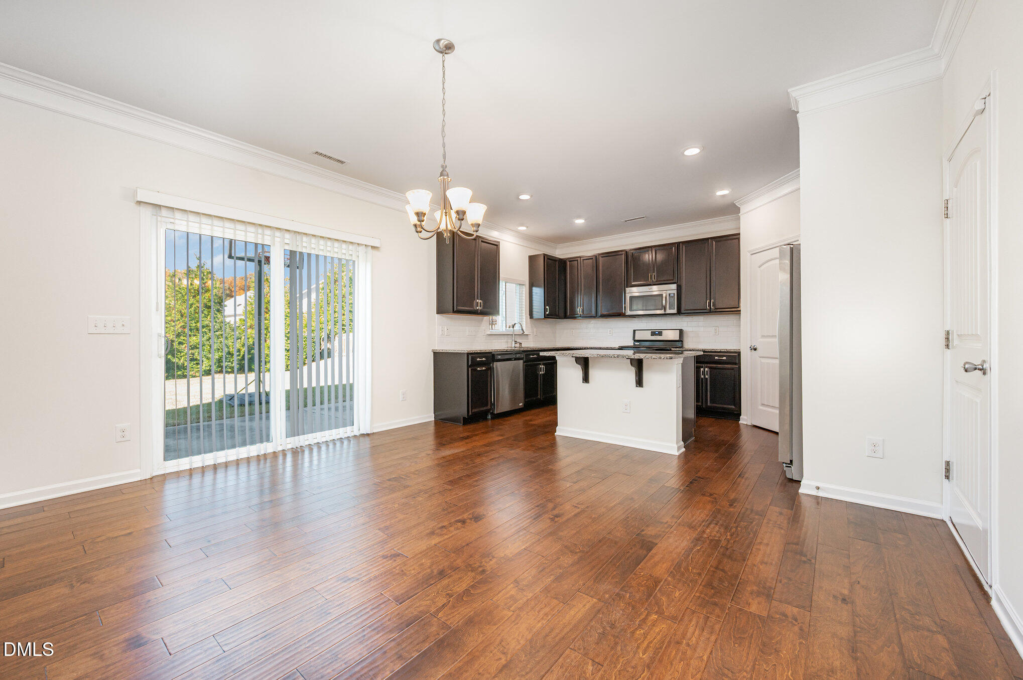 104 Oak Rise Lane Fuquay-Varina, NC 27526 - Photo 5 of 29 a view of a kitchen with a sink cabinets and wooden floor