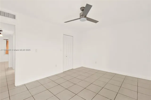 a bathroom with a sink shower and a mirror