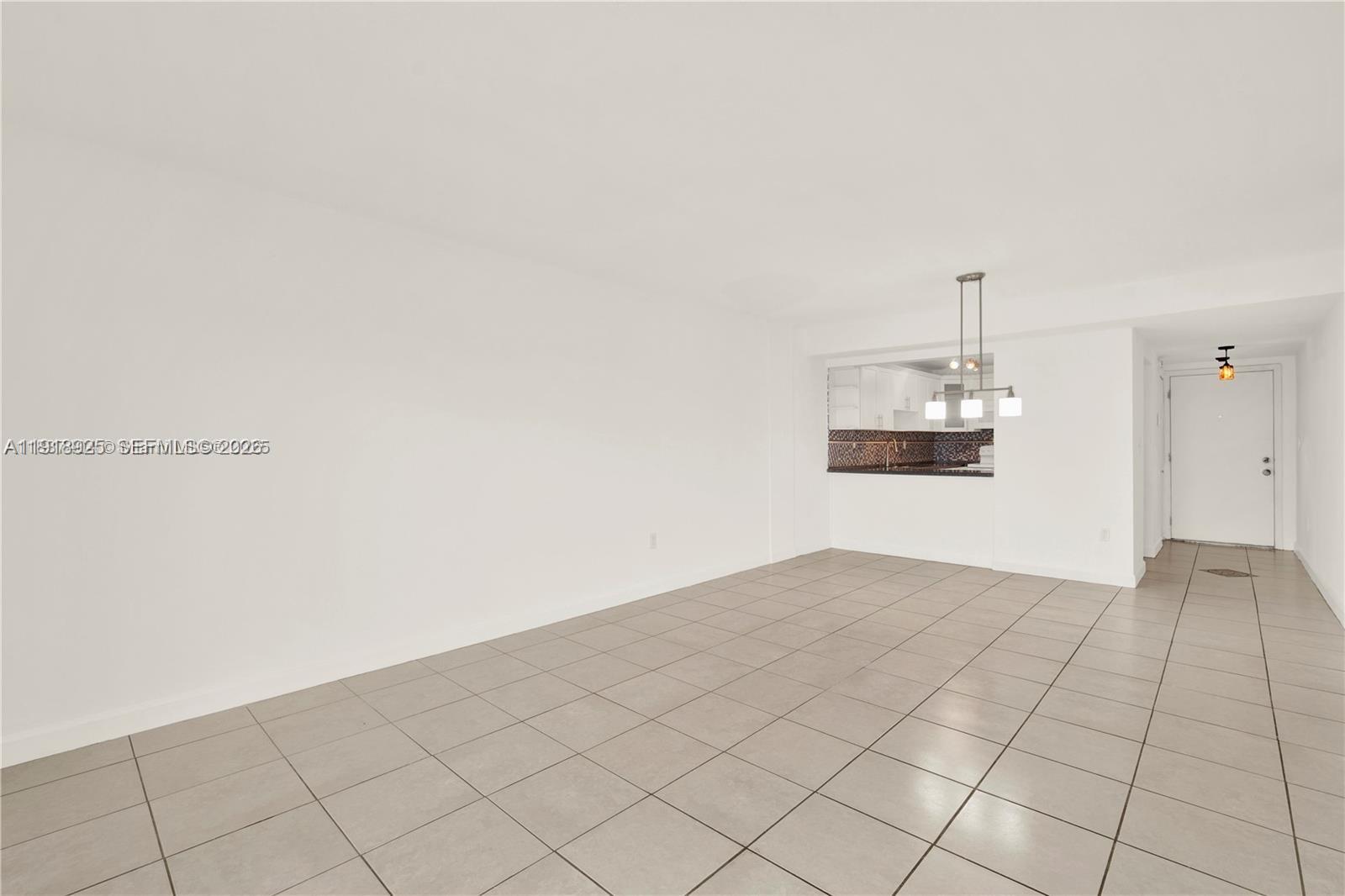 1990 West 56th Street, Unit 1407 Hialeah, FL 33012 - Photo 12 of 28 an empty room with windows