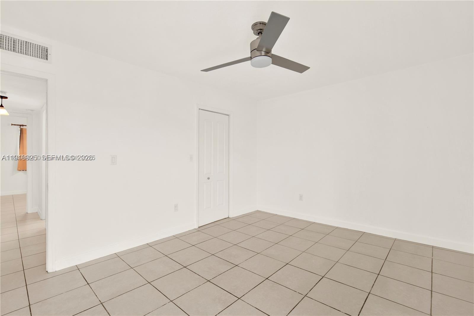 1990 West 56th Street, Unit 1407 Hialeah, FL 33012 - Photo 13 of 28 a view of a room with an empty space