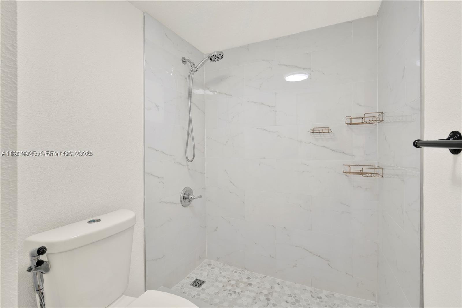 1990 West 56th Street, Unit 1407 Hialeah, FL 33012 - Photo 16 of 28 a bathroom with a shower