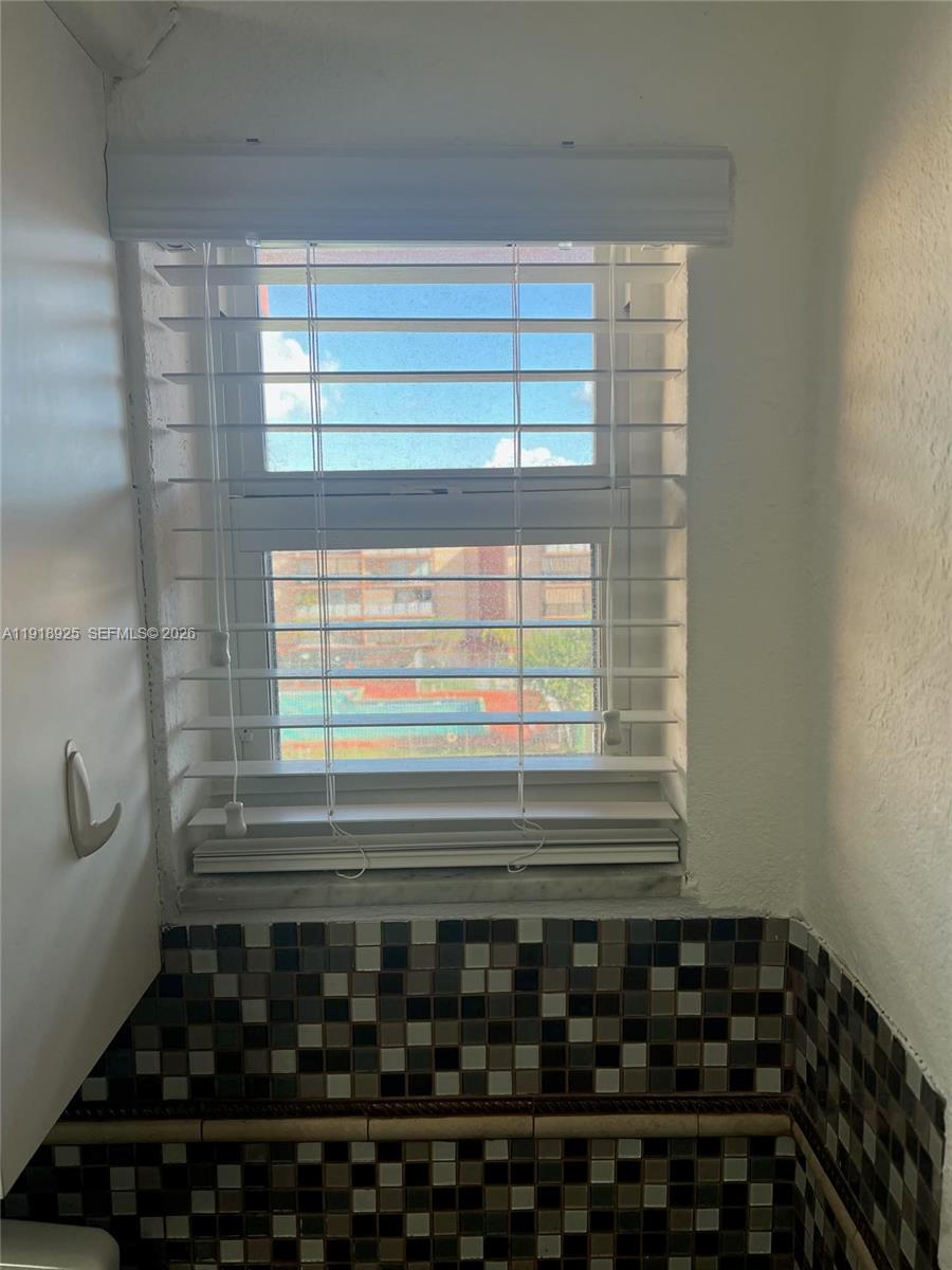 1990 West 56th Street, Unit 1407 Hialeah, FL 33012 - Photo 18 of 28 a bathroom with a window
