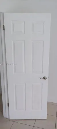 a view of a livingroom with a ceiling fan and a window